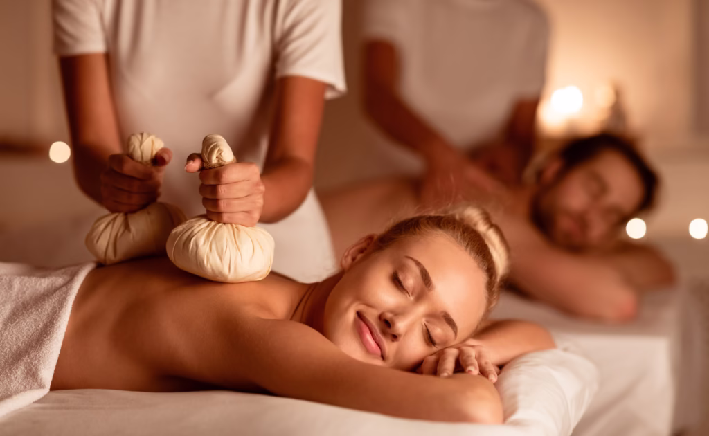 Couple,Enjoying,Herbal,Massage.,Relaxed,Husband,And,Wife,At,Exotic